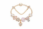 Gold Toned Bracelet with Peach Hearts & Diamond Accents