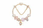 Gold Toned Bracelet with Peach Hearts & Diamond Accents
