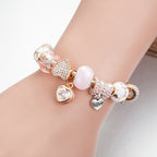 Gold Toned Bracelet with Peach Hearts & Diamond Accents