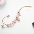 Gold Toned Bracelet with Peach Hearts & Diamond Accents